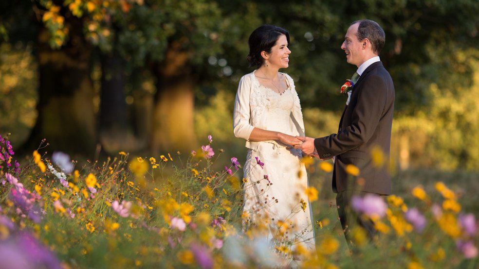 Wedding photograph at Roundhay Park, Leeds with colourful wild flowers